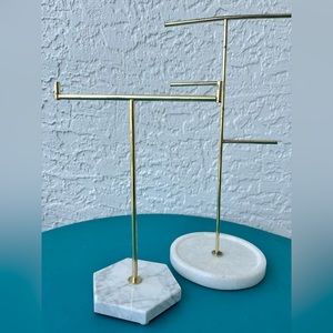 Two jewelry holder stands.